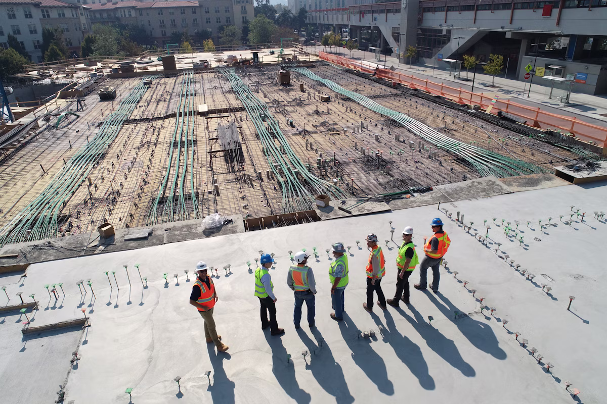 Construction crew assembling a building on site